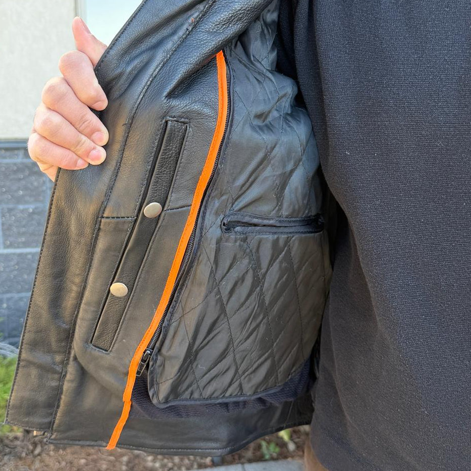 A man wearing a black leather motorcycle jacket