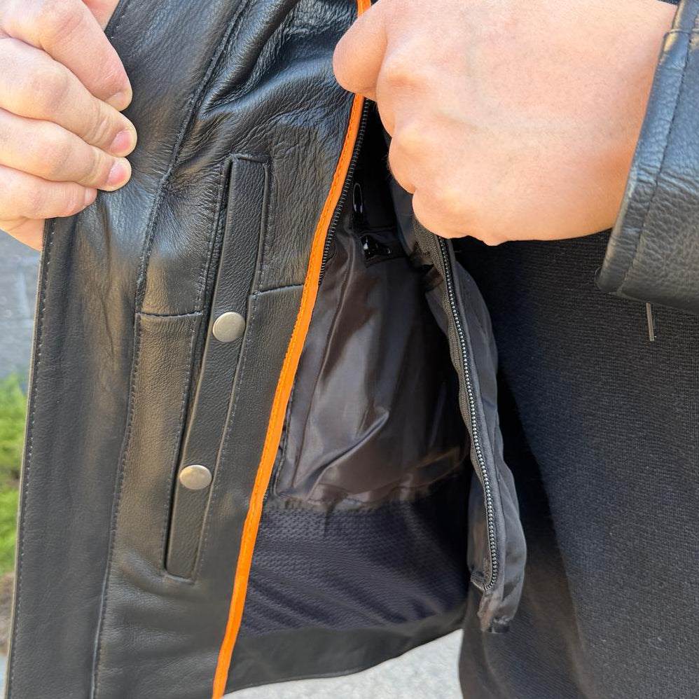 A man wearing a black leather motorcycle jacket