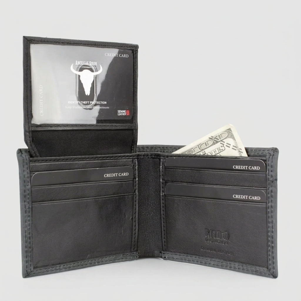 A black leather bi-fold wallet shown open, displaying its interior compartments, including a clear ID window with a bull logo, card slots, and a dollar bill tucked into the cash compartment, set against a plain white background.
