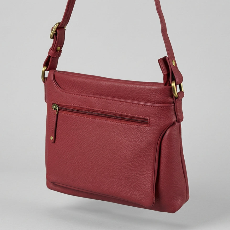 A burgundy pebbled leather crossbody bag with gold-tone hardware