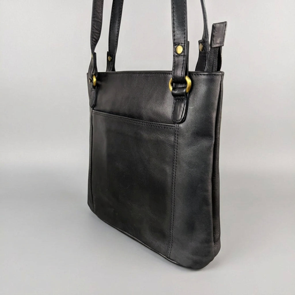 A black leather shoulder bag with gold-tone hardware