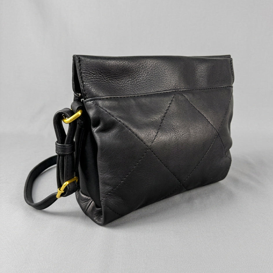 Black leather crossbody bag with a diamond-quilted pattern on the front flap and gold-tone hardware