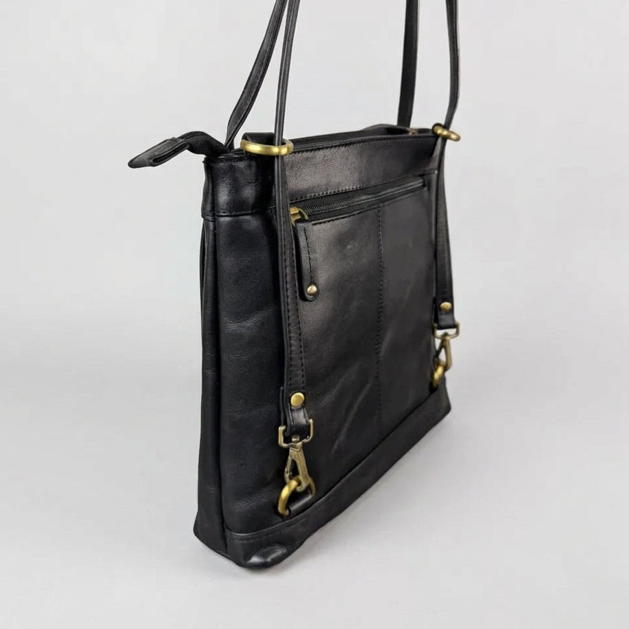 A black leather crossbody bag with gold-tone hardware