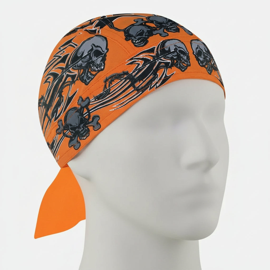 Orange head wrap with black skull and crossbones design on a white background