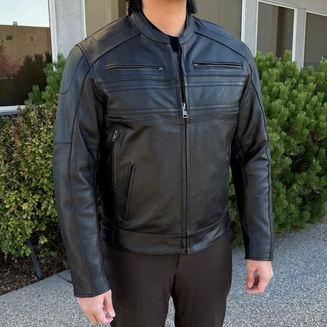 A man wearing a black leather motorcycle jacket