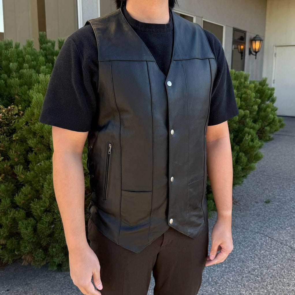 A man wearing a black leather vest