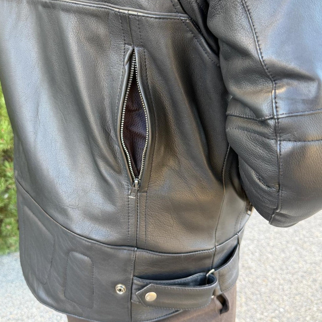 A man wearing a black leather motorcycle jacket