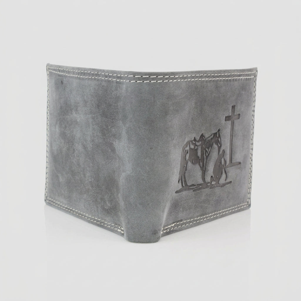 A gray leather bi-fold wallet with white contrast stitching and an embossed design of a cowboy, horse, and cross on the front panel, shown on a white background.