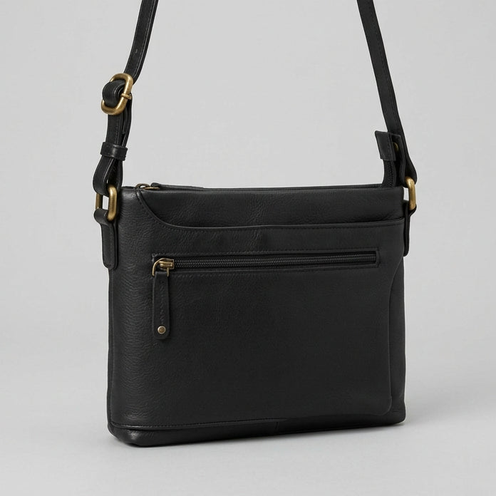 A black leather crossbody bag with gold-tone hardware