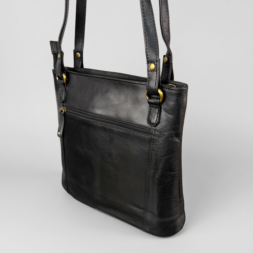 A black leather shoulder bag with gold-tone hardware