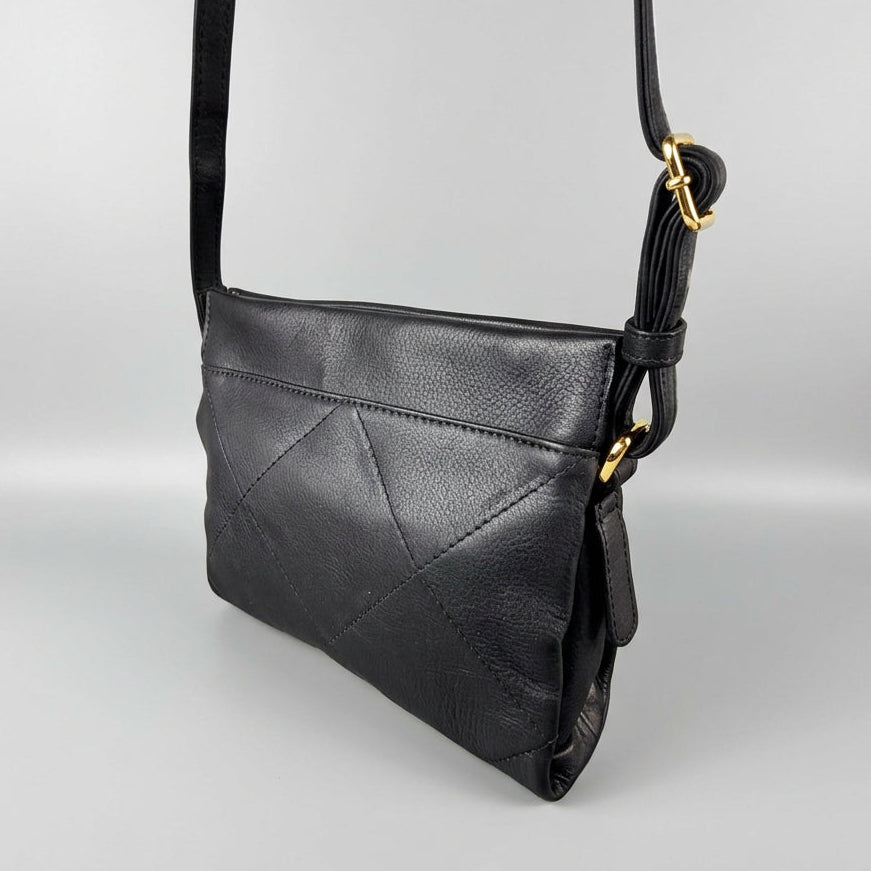 A black pebbled leather crossbody bag with a geometric quilted pattern