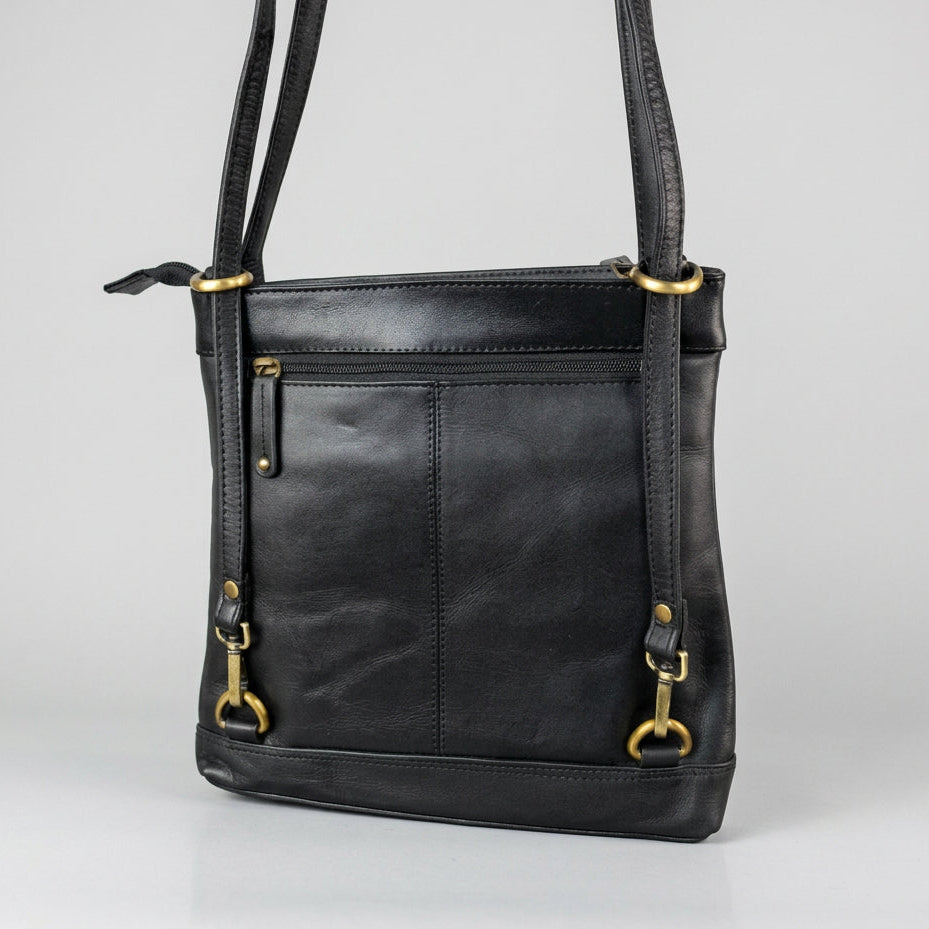 A black leather shoulder bag with gold-tone hardware